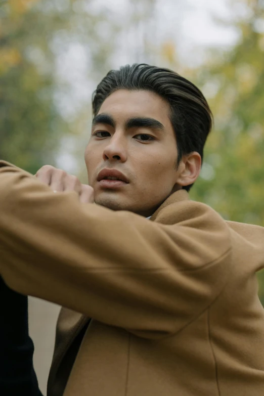 a couple of men standing next to each other, inspired by Tadashi Nakayama, trending on pexels, brown sweater, model face, siwoo kim, peruvian looking