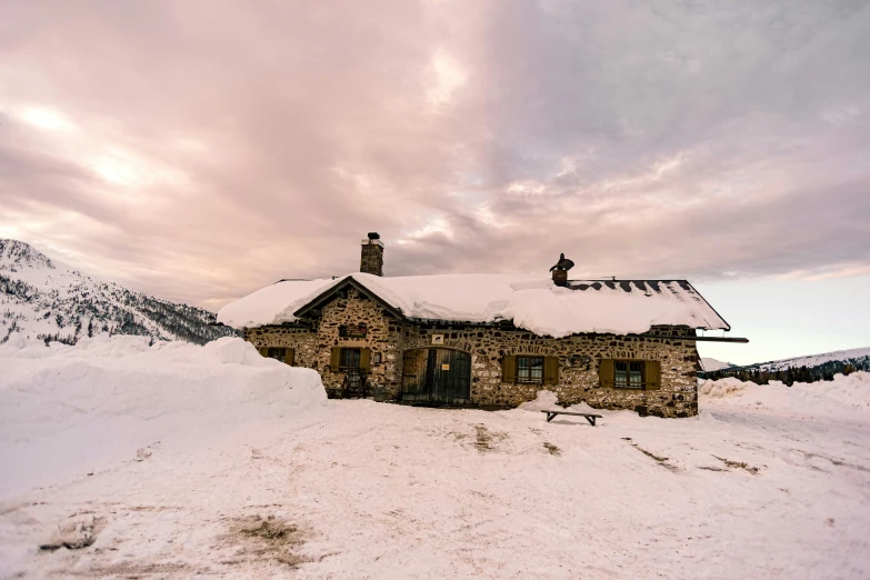 a stone building sitting in the middle of a snow covered field, les nabis, cafe in the clouds, profile image