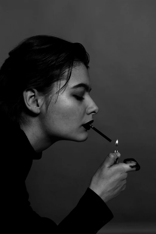 a black and white photo of a woman smoking a cigarette, inspired by irakli nadar, frank dillane, rachel weisz, profile image, androgynous person