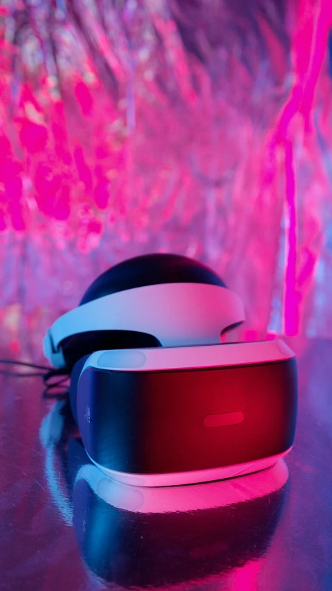 a pair of headphones sitting on top of a table, a hologram, pexels, brightly lit pink room, vr game, it has a red and black paint, thumbnail