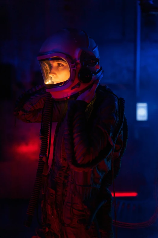 a man in a space suit talking on a cell phone, a portrait, inspired by roger deakins, pexels, light and space, 70's jetfighter pilot girl, vivid atmospheric lighting, girl looks at the space, intense smoldering