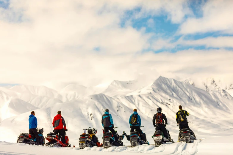 a group of people standing on top of a snow covered slope, riding, profile image, pits, vivid colours