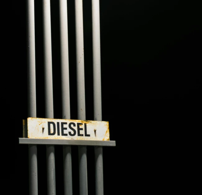 a close up of a street sign on a pole, inspired by Elsa Bleda, unsplash, dau-al-set, diesel engine, in front of a black background, metal bars, photo render