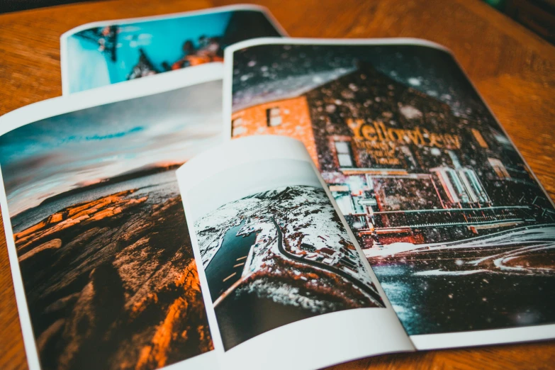 an open book sitting on top of a wooden table, a picture, pexels contest winner, art photography, magazine pages, 4 color print, tourist photo, shot from below