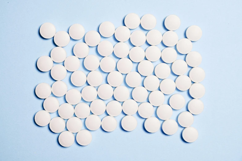 a pile of white pills on a blue surface, by Carey Morris, antipodeans, trending on dezeen, hundreds of eyes, panels, 15081959 21121991 01012000 4k