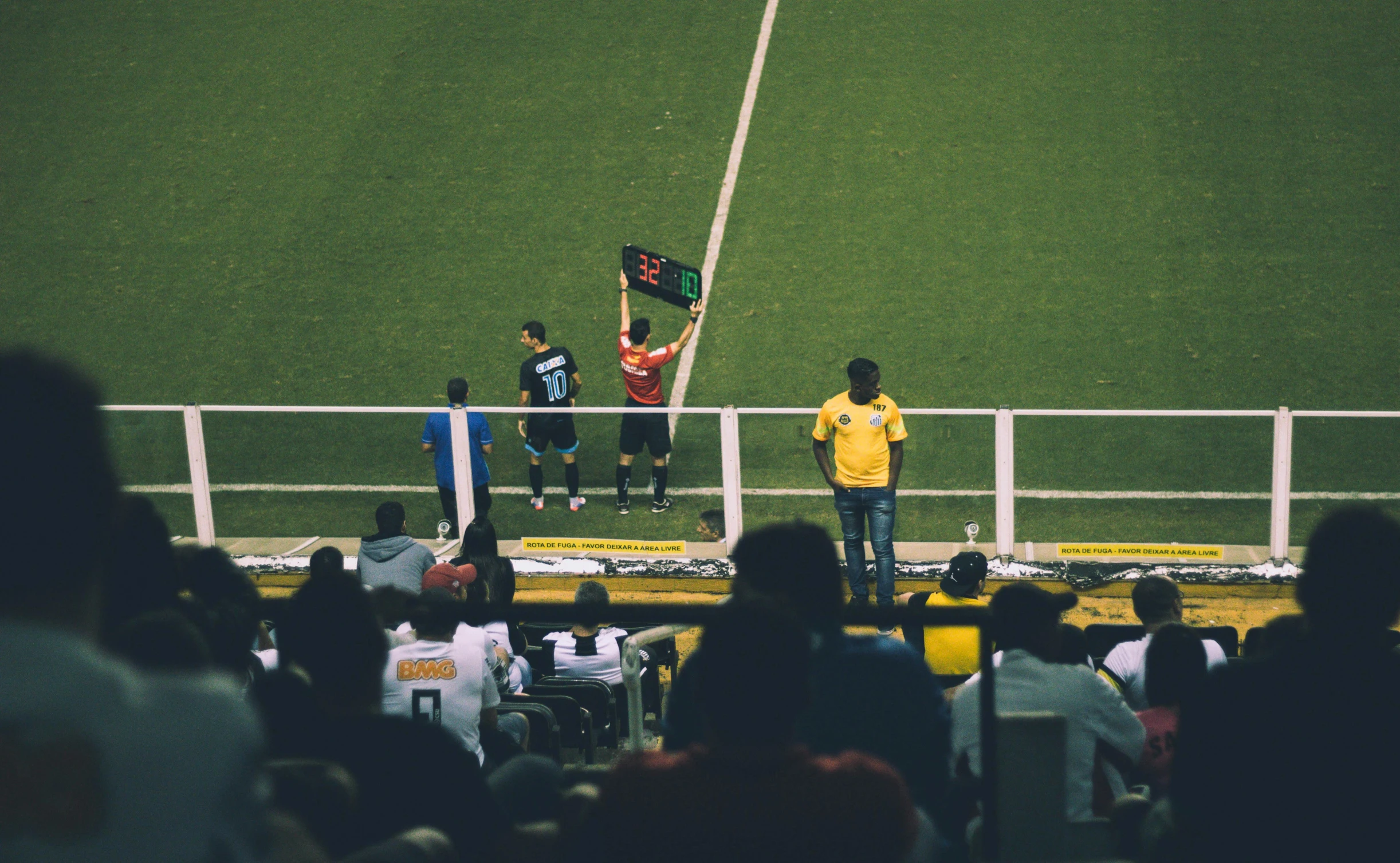 a group of people standing on top of a soccer field, pexels contest winner, people watching, square, banner, brazilian