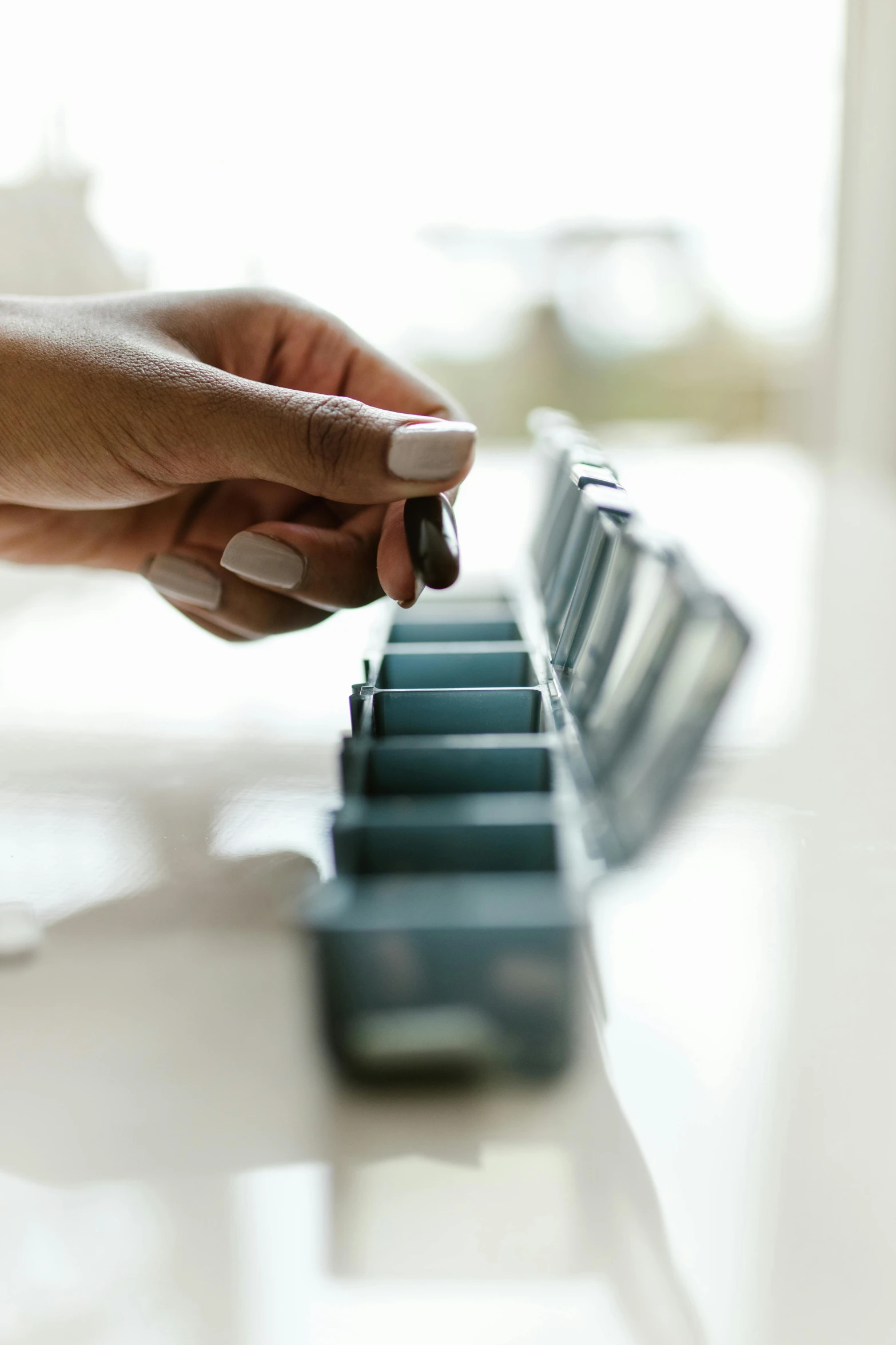 a close up of a person's hand on a keyboard, an album cover, by Jessie Algie, unsplash, offering the viewer a pill, dividing it into nine quarters, at home, instagram picture