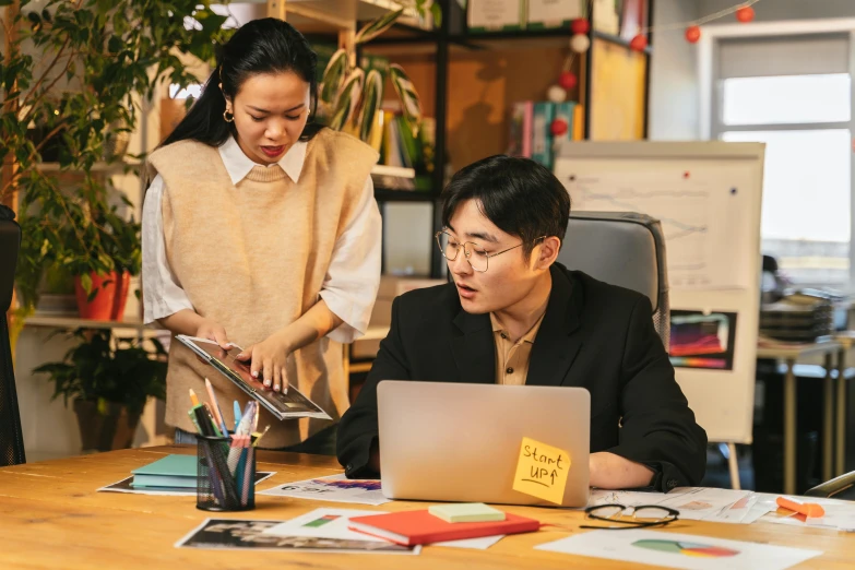 a couple of people sitting at a table with a laptop, a picture, by Jang Seung-eop, trending on pexels, avatar image, teaching, south korean male, 15081959 21121991 01012000 4k