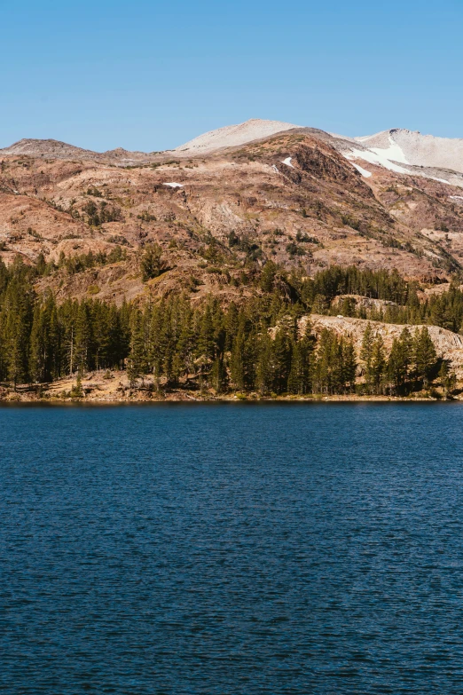 a large body of water with a mountain in the background, by Joe Stefanelli, mammoth, slide show, lakes, banner