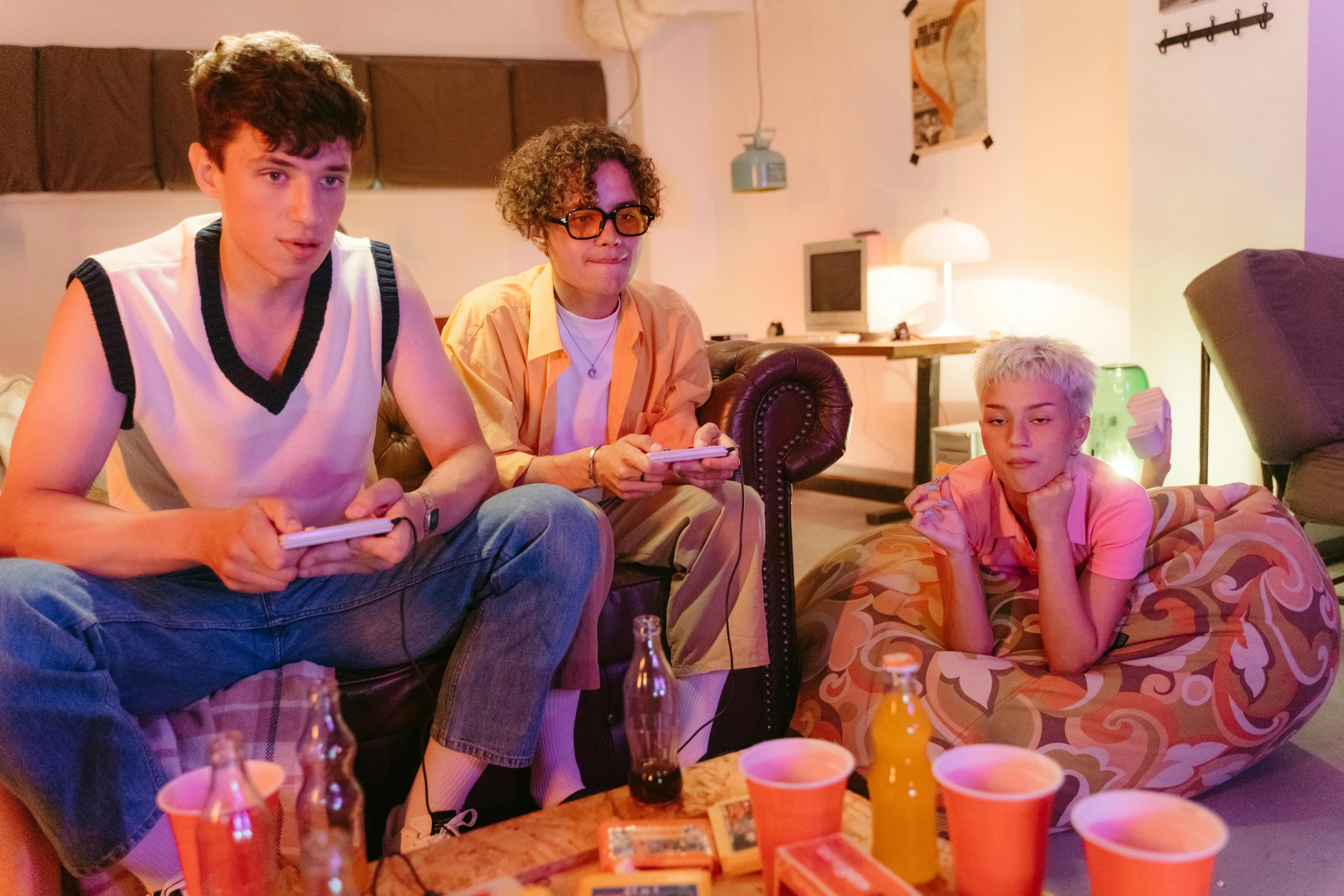 a group of people sitting on top of a couch, pexels, serial art, twins playing video games, sophia lillis, neon jungle, beautiful boy