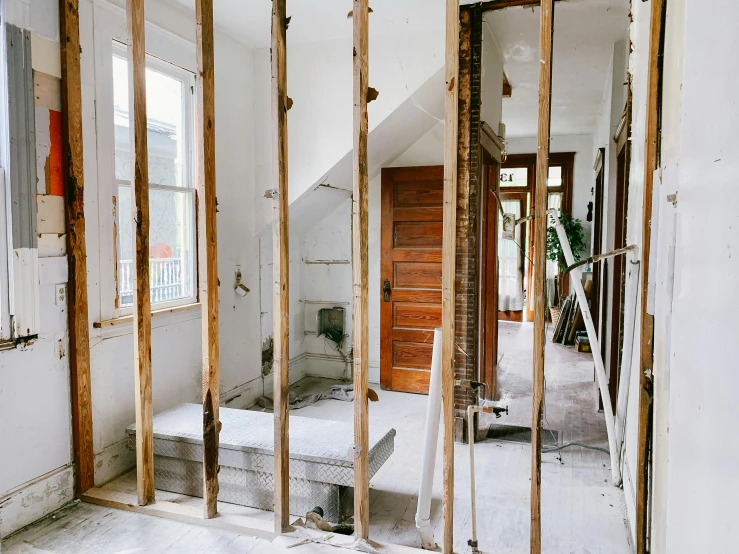 a picture of a room that is being remodeled, by Carey Morris, pexels contest winner, exposed inner structure, white marble walls, steel studs, thumbnail