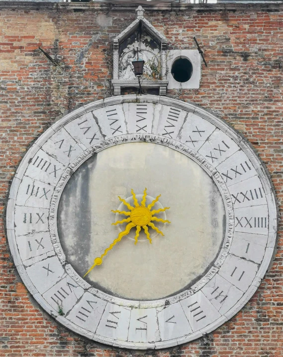 a large clock mounted to the side of a brick building, an album cover, inspired by Piero della Francesca, pexels contest winner, renaissance, a yellow sun shining down, zodiac signs, venice, 3 4 5 3 1