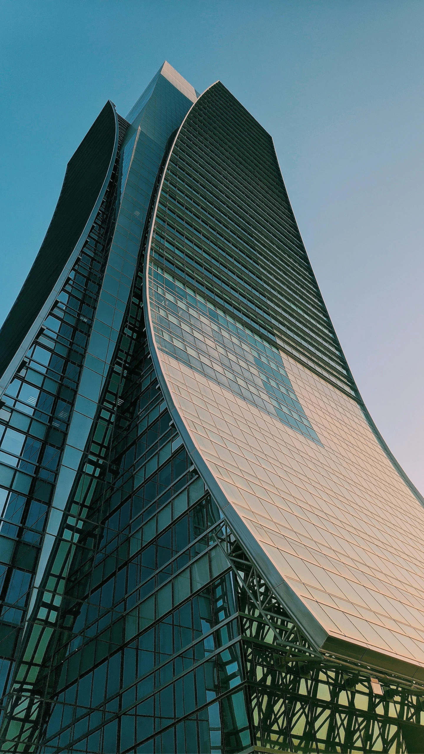 a very tall building with a lot of windows, inspired by Zaha Hadid, unsplash contest winner, moscow, flowing curves, waist - up, wide screenshot