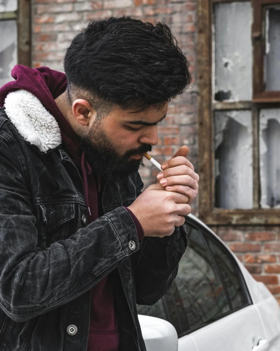 a man standing next to a car smoking a cigarette, profile image, lgbtq, drinking cough syrup, riyahd cassiem