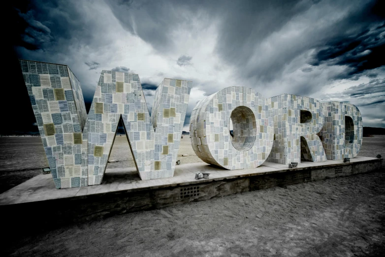a sign that says work in front of a cloudy sky, a mosaic, by James Morris, unsplash contest winner, concrete art, global illumination hdri, futuristic phnom-penh cambodia, shore, the letter w