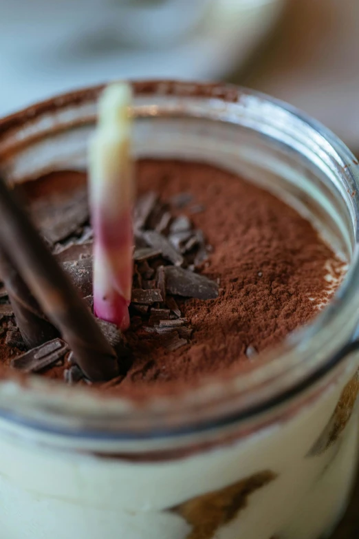 a close up of a dessert in a jar, fully chocolate, incense, milkshake, thumbnail