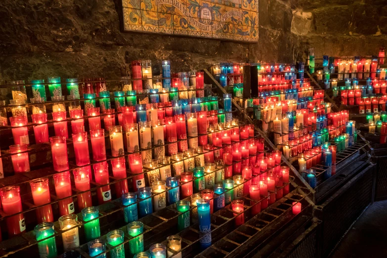 a bunch of candles that are next to each other, by Daniel Lieske, pexels, graffiti, iconostasis in the bar, avatar image, colorful mosaic, concert photo