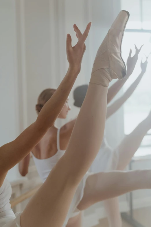 a group of ballerinas in a dance studio, trending on unsplash, arabesque, subtle detailing, soft glow, demur, white