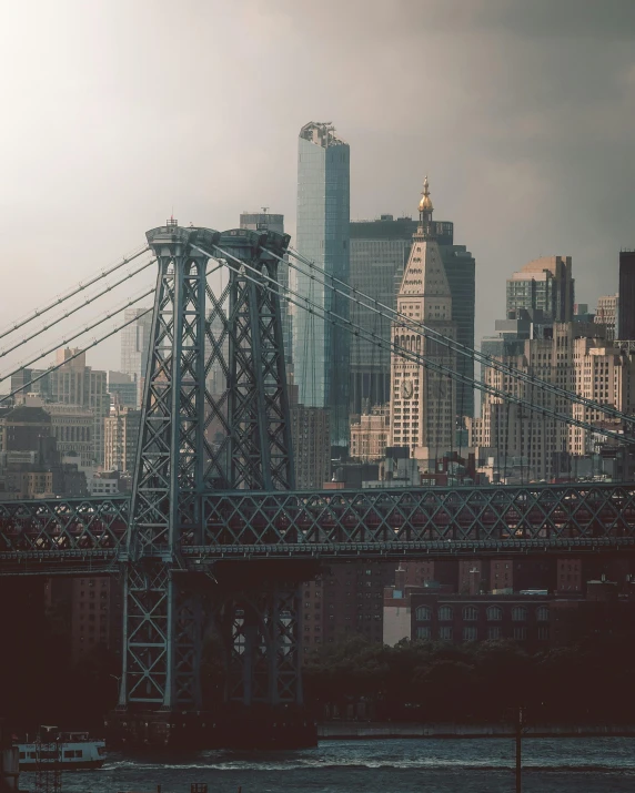 a bridge over a body of water with a city in the background, a colorized photo, inspired by Elsa Bleda, unsplash contest winner, harlem renaissance, tall metal towers, white buildings, on a dark background, instagram story