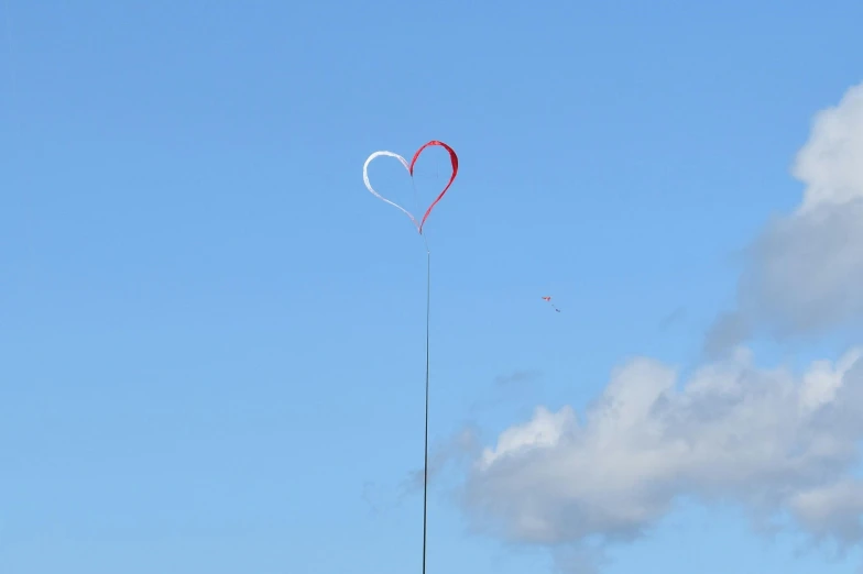 a couple of kites that are flying in the sky, a picture, by Niko Henrichon, kinetic art, heart, skye meaker, 15081959 21121991 01012000 4k, long distance photo