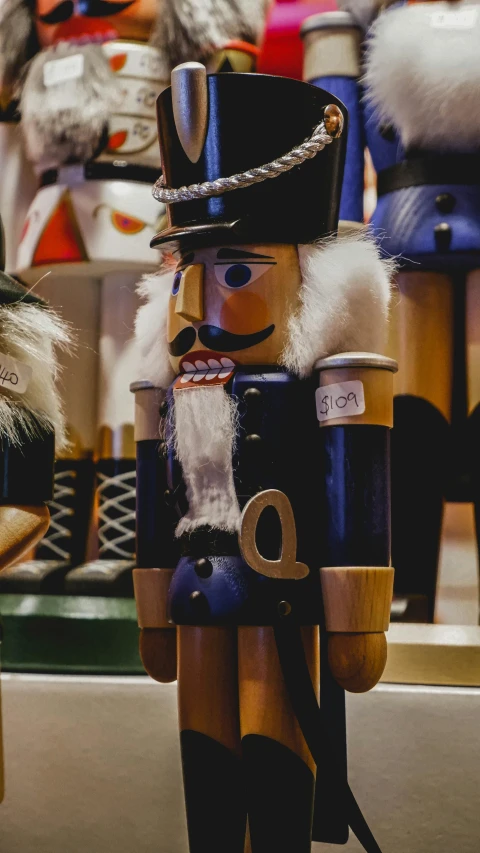 a couple of nutcrackers sitting next to each other, by Sebastian Spreng, trending on unsplash, sitting on a store shelf, thumbnail, high quality photo, navy