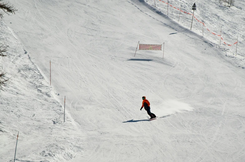 a man riding a snowboard down a snow covered slope, sloped site, orange and white, sports setting, thumbnail