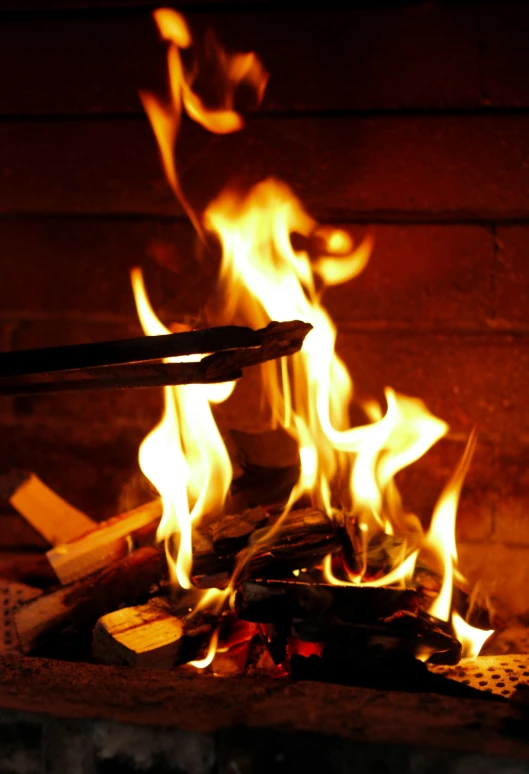 a close up of a fire in a brick oven, an album cover, flickr, s'mores, fire staff, photograph credit: ap, multiple stories