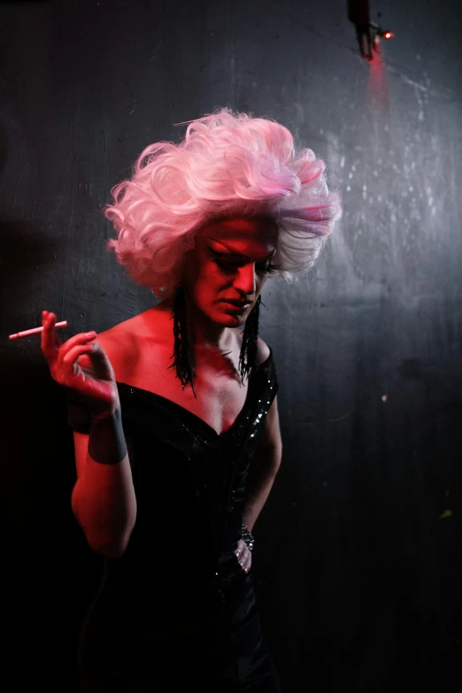 a woman in a black dress smoking a cigarette, inspired by Nan Goldin, powdered wig, performing on stage, pink iconic character, promo photo