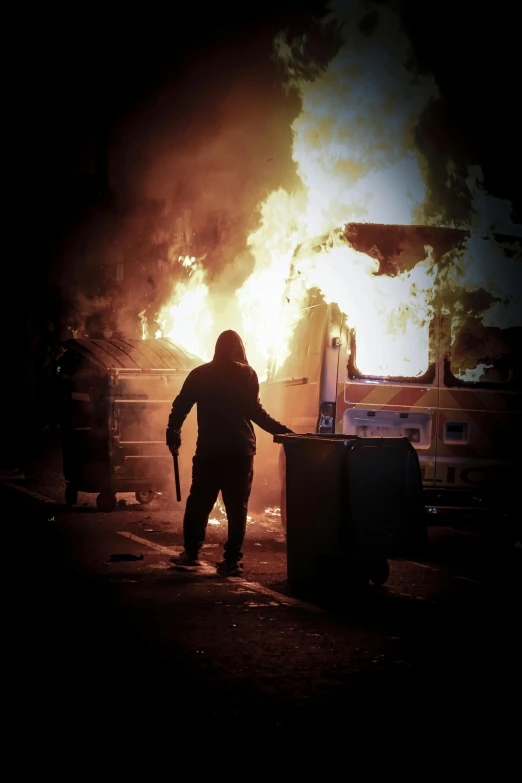 a person standing in front of a fire, auto-destructive art, violent protest, burning bus inferno, profile image, trending photo