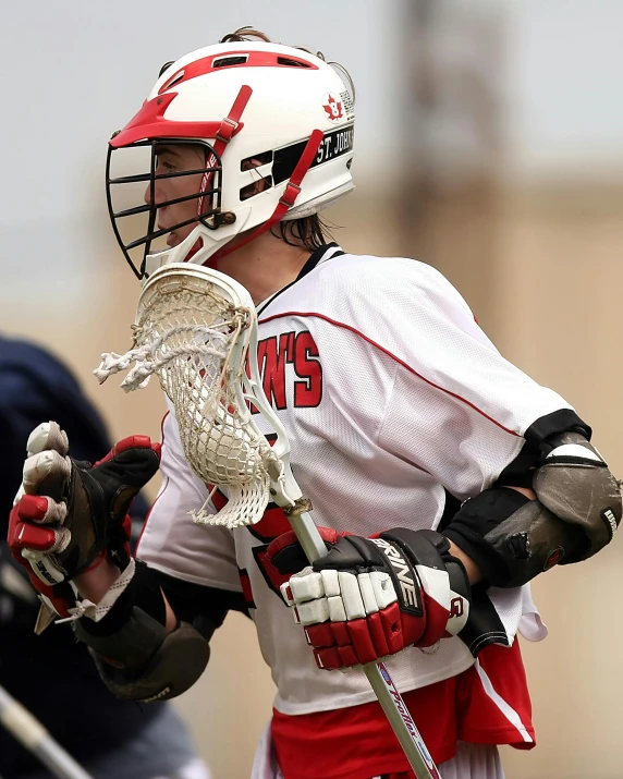 a group of men playing a game of lacrosse, shutterstock contest winner, red and white, looking to his left, dylan kowalsk, profile pic