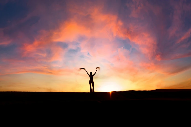 a person standing on top of a hill with their arms in the air, pexels contest winner, dawn mcteigue, avatar image, long arms, scientific photo