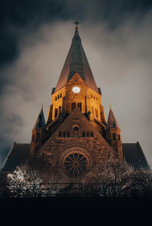 a very tall building with a clock at the top, an album cover, by Jens Søndergaard, pexels contest winner, romanesque, dark gloomy church, cornell, brown, marilyn church h