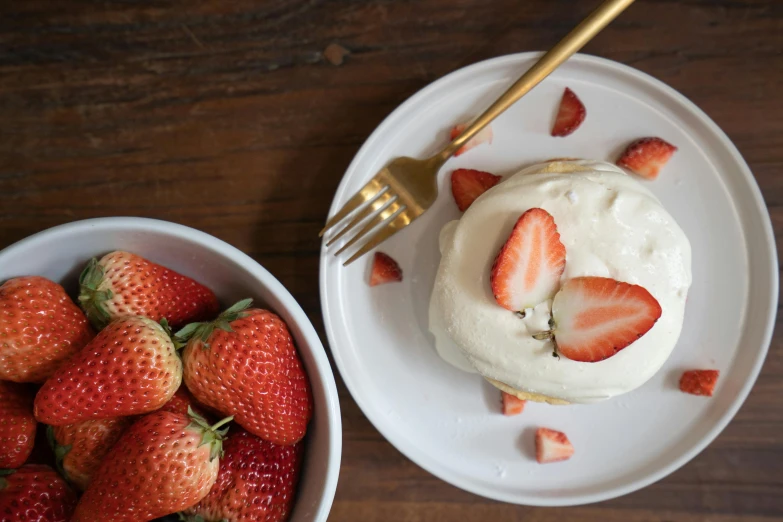 a white plate topped with strawberries next to a bowl of strawberries, inspired by Richmond Barthé, unsplash, steamed buns, pancakes, dwell, thumbnail