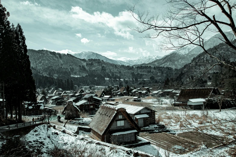 a village in the mountains covered in snow, inspired by Maruyama Ōkyo, unsplash contest winner, old photo of a creepy landscape, medium format, quaint, portrait photo