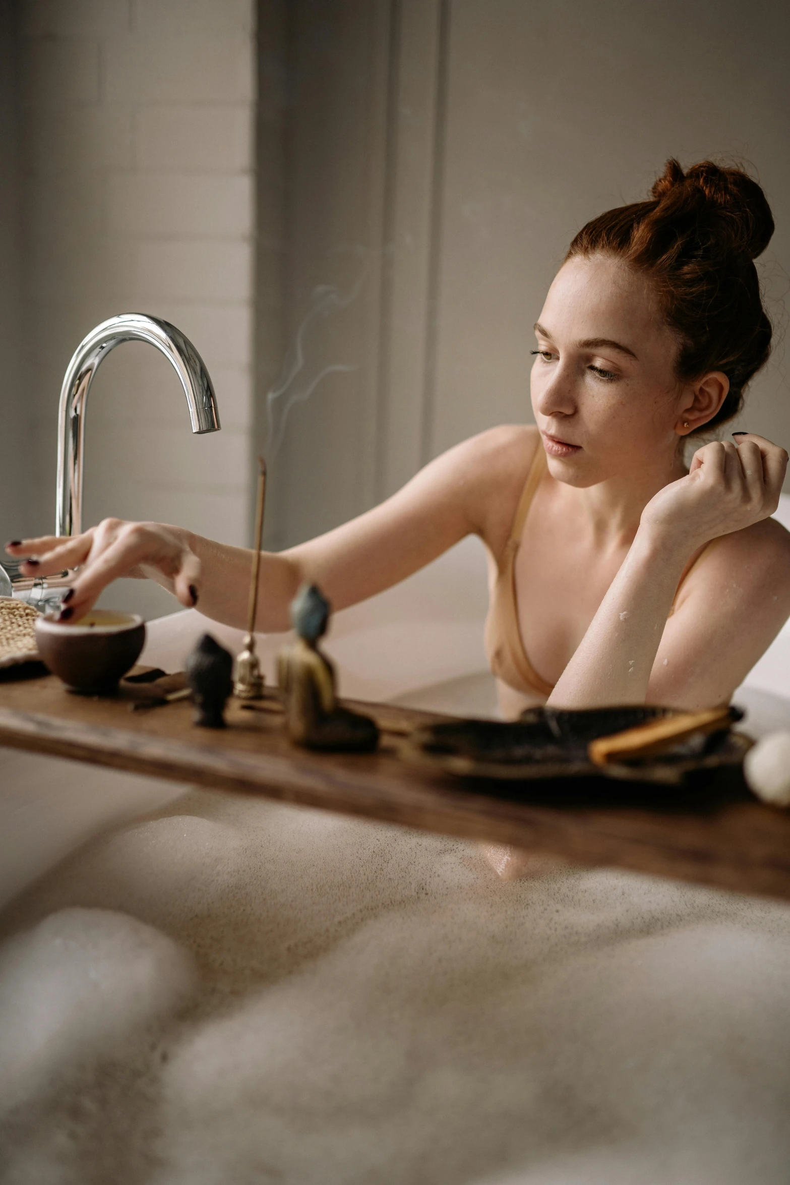 a woman sitting in a bathtub with a plate of food, by Julia Pishtar, trending on pexels, renaissance, ginger, soap, concentrated, smooth detailed