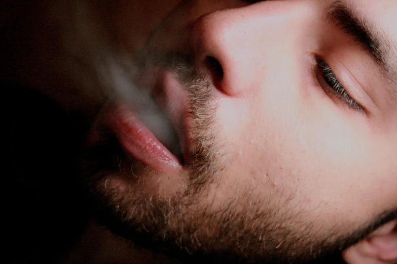 a close up of a person smoking a cigarette, trending on pexels, hyperrealism, stubble on his face, dreaming of kissing a girl, smoking a bowl of hash together, smoke lasers