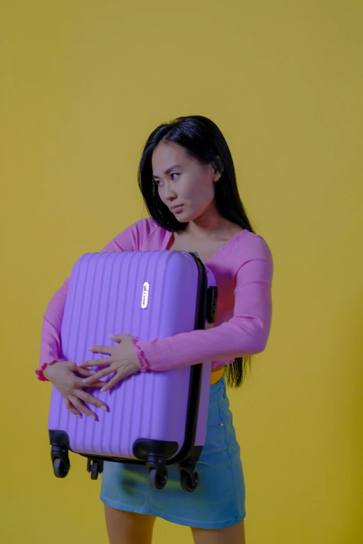 a woman is holding a piece of luggage, pexels contest winner, purple volumetric lighting, embarrassing, gemma chen, e - girl