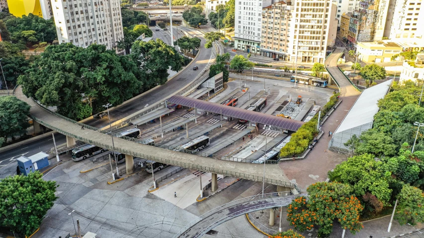 an aerial view of a train station in a city, an album cover, by Felipe Seade, unsplash, sao paulo in the year 2 0 7 0, square, overpass, an abandoned