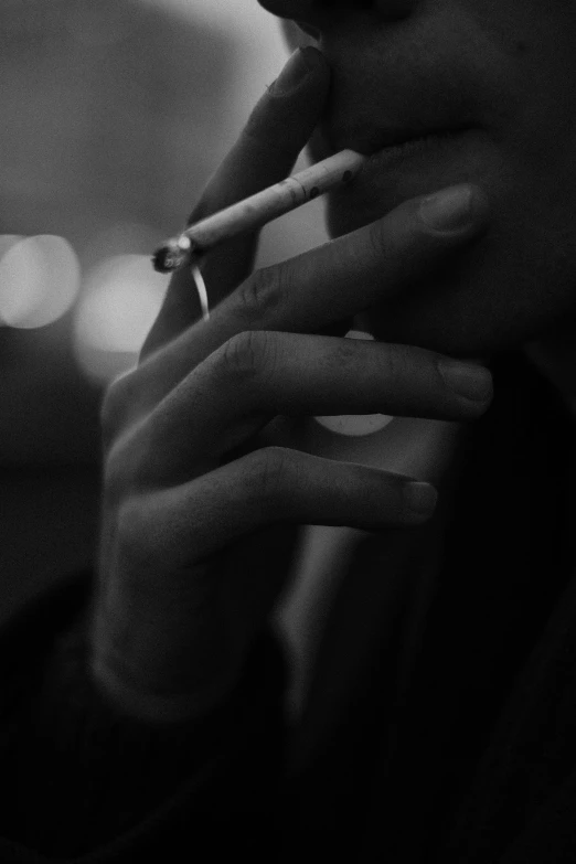 a black and white photo of a man smoking a cigarette, a black and white photo, unsplash, aestheticism, hands of men, night, smoking woman, destroy lonely