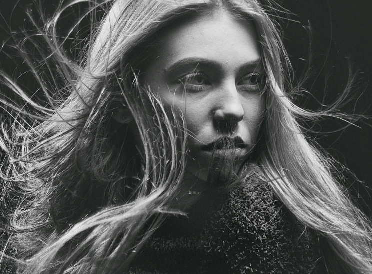 a black and white photo of a woman with long hair, by irakli nadar, chloë grace moretz, editorial photo from magazine, windblown, closeup!!!!!!