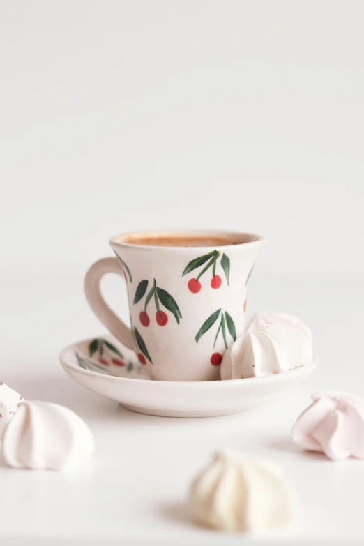 a cup of coffee sitting on top of a saucer, cherries, designed for cozy aesthetics!, jen atkin, marshmallow