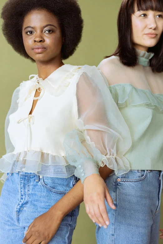 a couple of women standing next to each other, an album cover, inspired by Elsa Bleda, renaissance, cream colored blouse, pastel green, closeup - view, puff sleeves