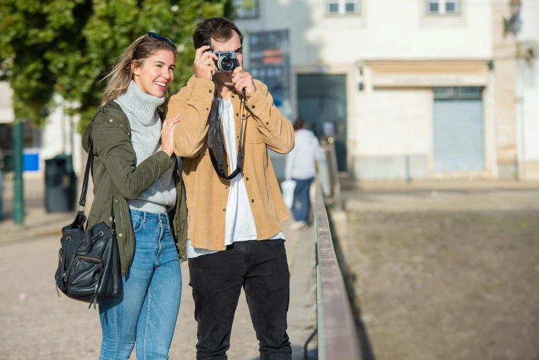 a man taking a picture of a woman with a camera, happening, casually dressed, beginner, lisbon, profile image