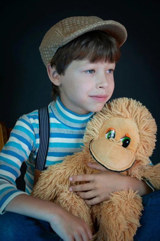a young boy sitting on a chair holding a teddy bear, inspired by Sam Havadtoy, pexels, caracter with brown hat, concern, slide show, hugs