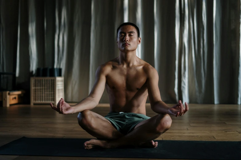 a man sitting in the middle of a yoga pose, a portrait, inspired by Li Shixing, unsplash, 千 葉 雄 大, portrait shot 8 k, high quality upload, medium long shot