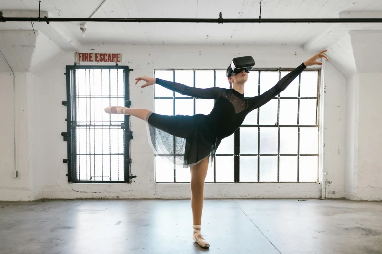 a woman in a black leoper leoper leoper leoper leoper leoper leoper leoper leoper leoper leoper leo, a hologram, by Nicolette Macnamara, unsplash, arabesque, dressed as a ballerina, using a vr headset, sydney hanson, lachlan bailey