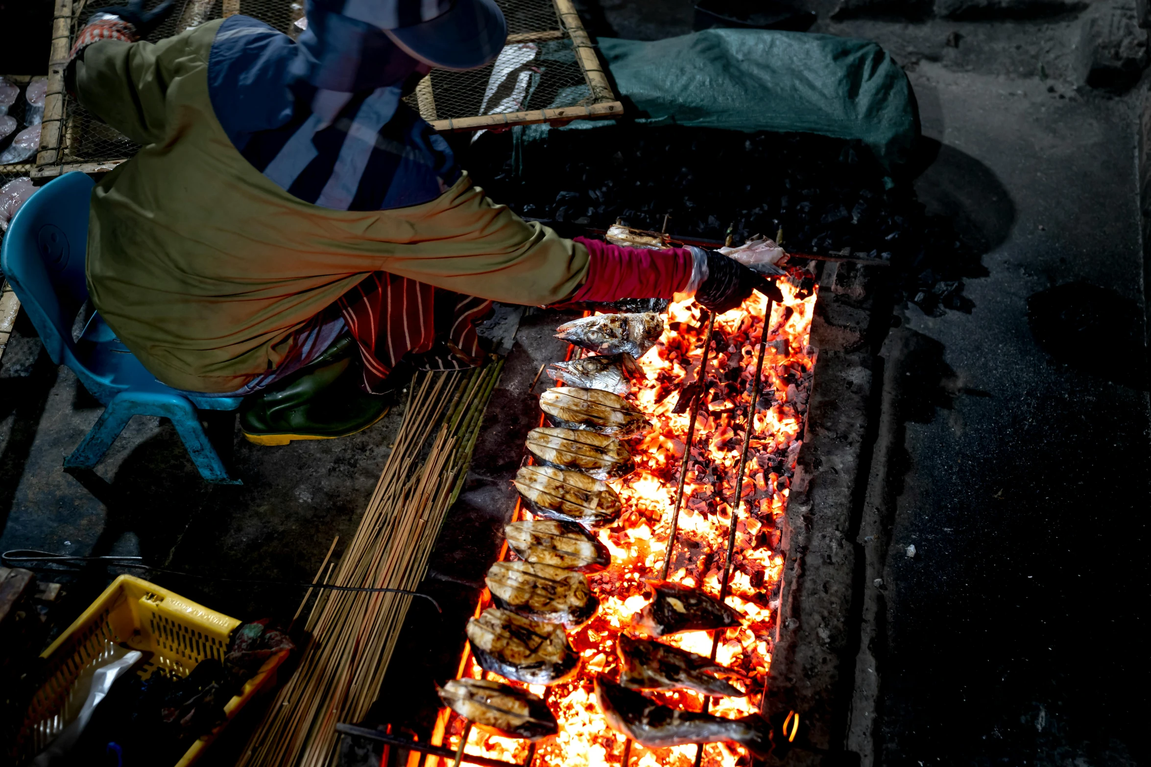 a person that is cooking some food on a grill, sōsaku hanga, an award winning photo, thumbnail, fish seafood markets, 🦩🪐🐞👩🏻🦳