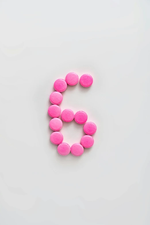 pink pills arranged in the shape of the letter s, an album cover, by Sven Erixson, trending on pexels, antipodeans, 2 5 6 x 2 5 6 pixels, triple six, felt, g6