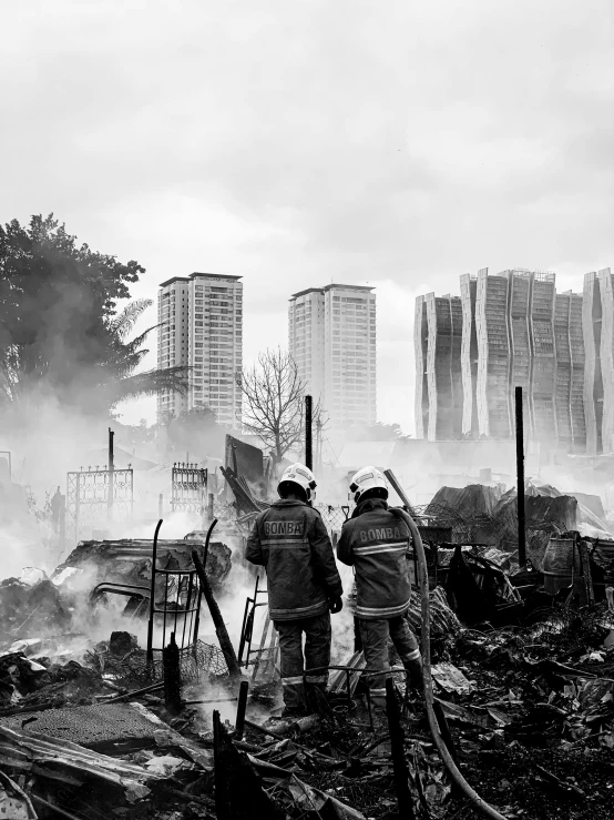 a group of men standing in front of a fire, by Joze Ciuha, destroyed modern buildings, cinematic. by leng jun, fireman, dzung phung dinh