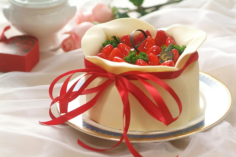 a close up of a plate with a cake on it, red ribbon, kakejiku, bouquet, berries inside structure